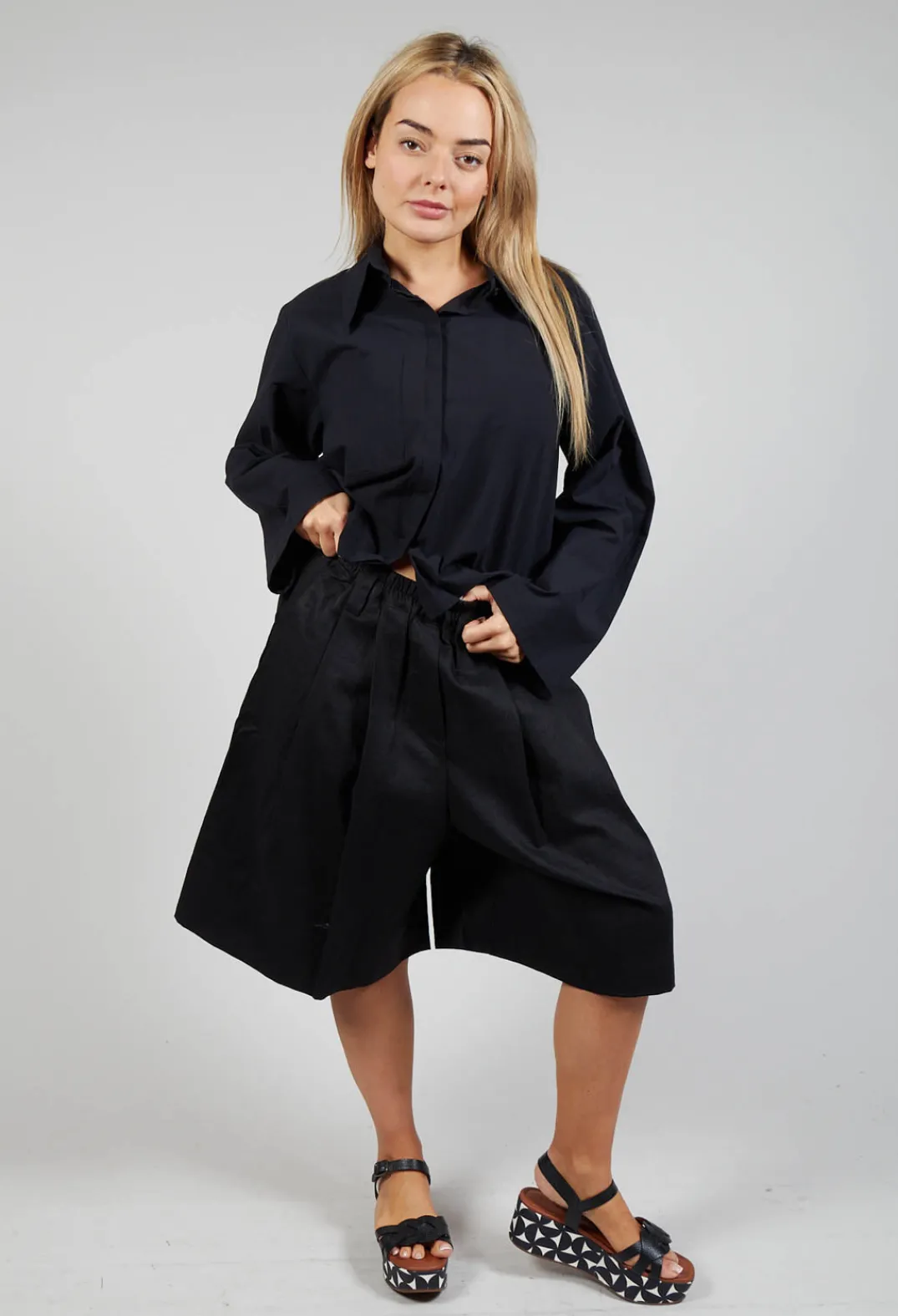 Les Filles d'Ailleurs Trousers^Pleated Shorts in Black
